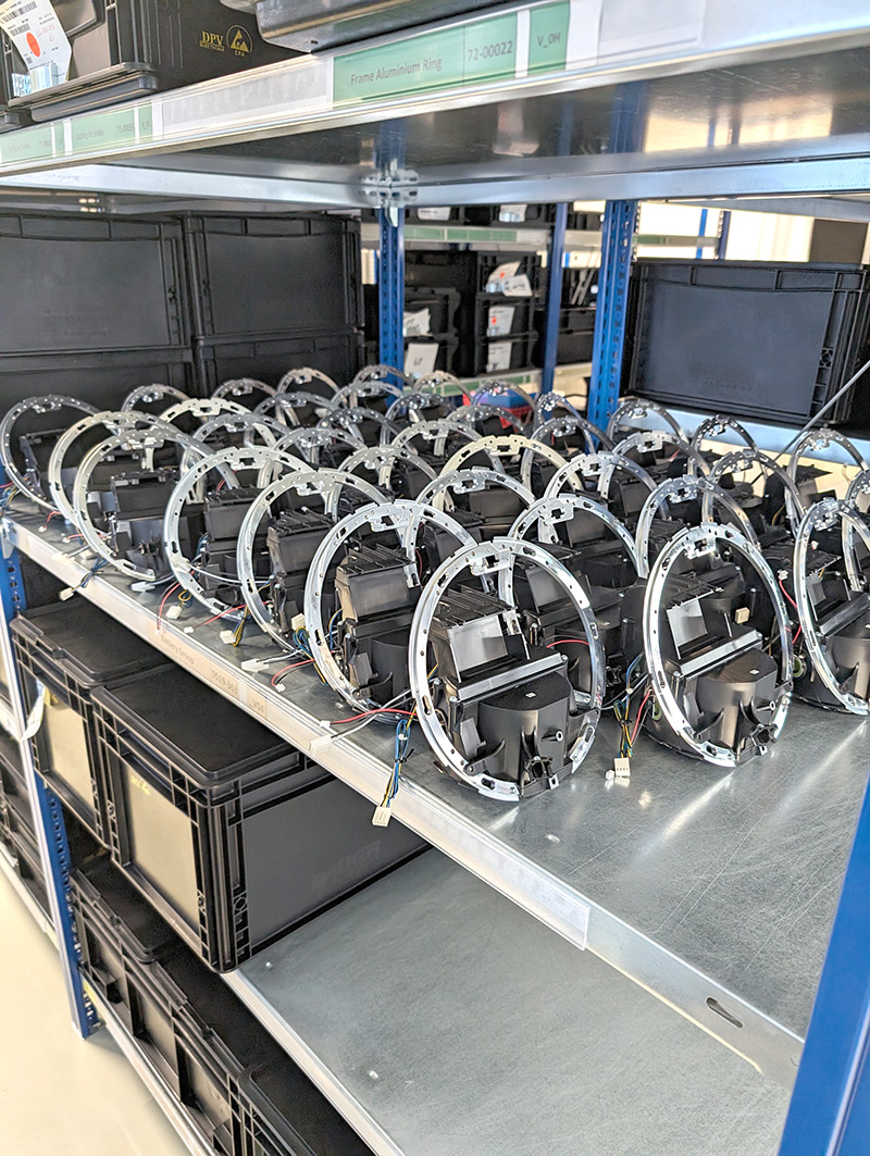 A shelf filled with multiple Orb devices organized in neat rows, showcasing the technology for biometric verification.