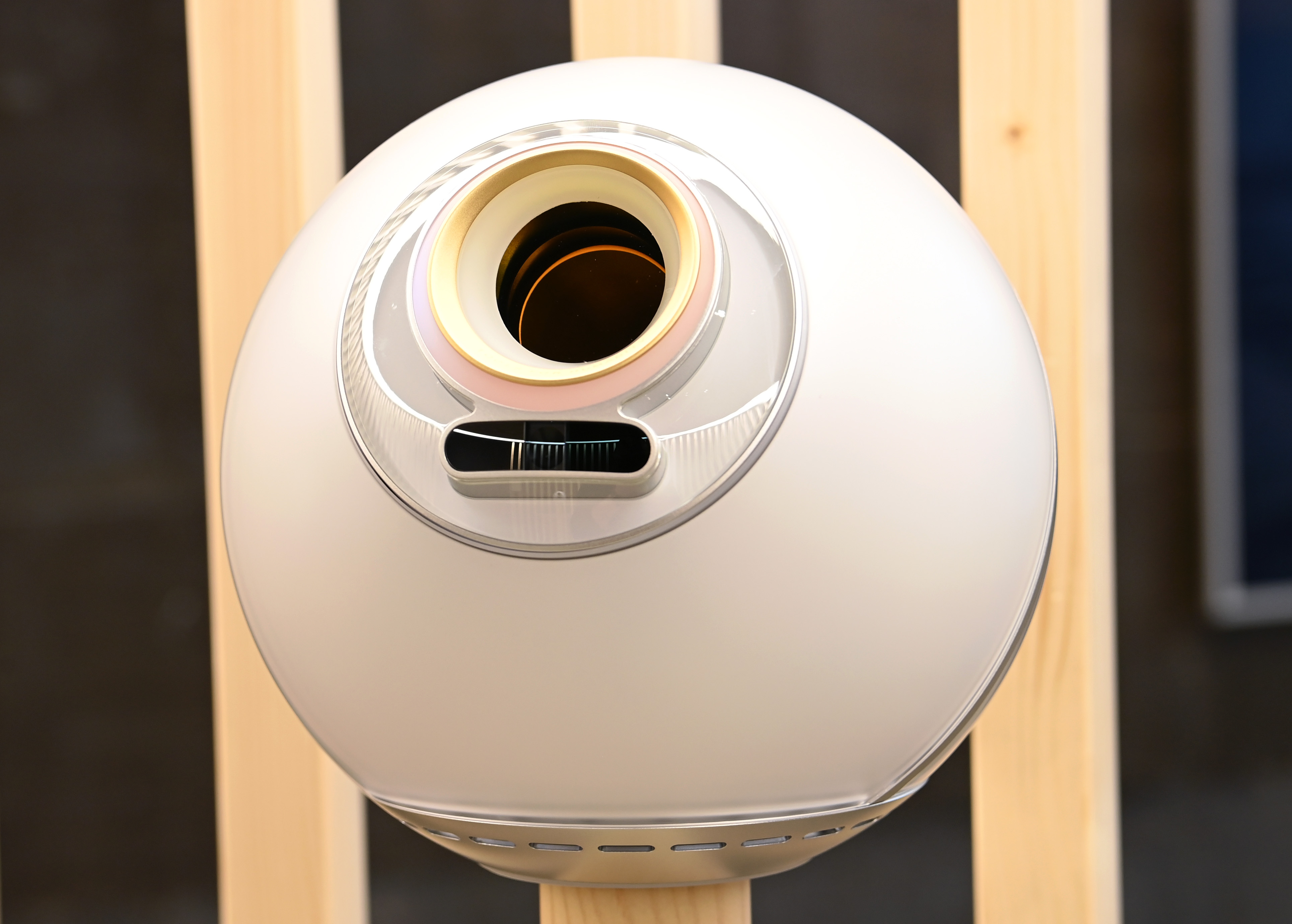 Close-up view of the Orb, the biometric verification device, showcasing its sleek, spherical design.