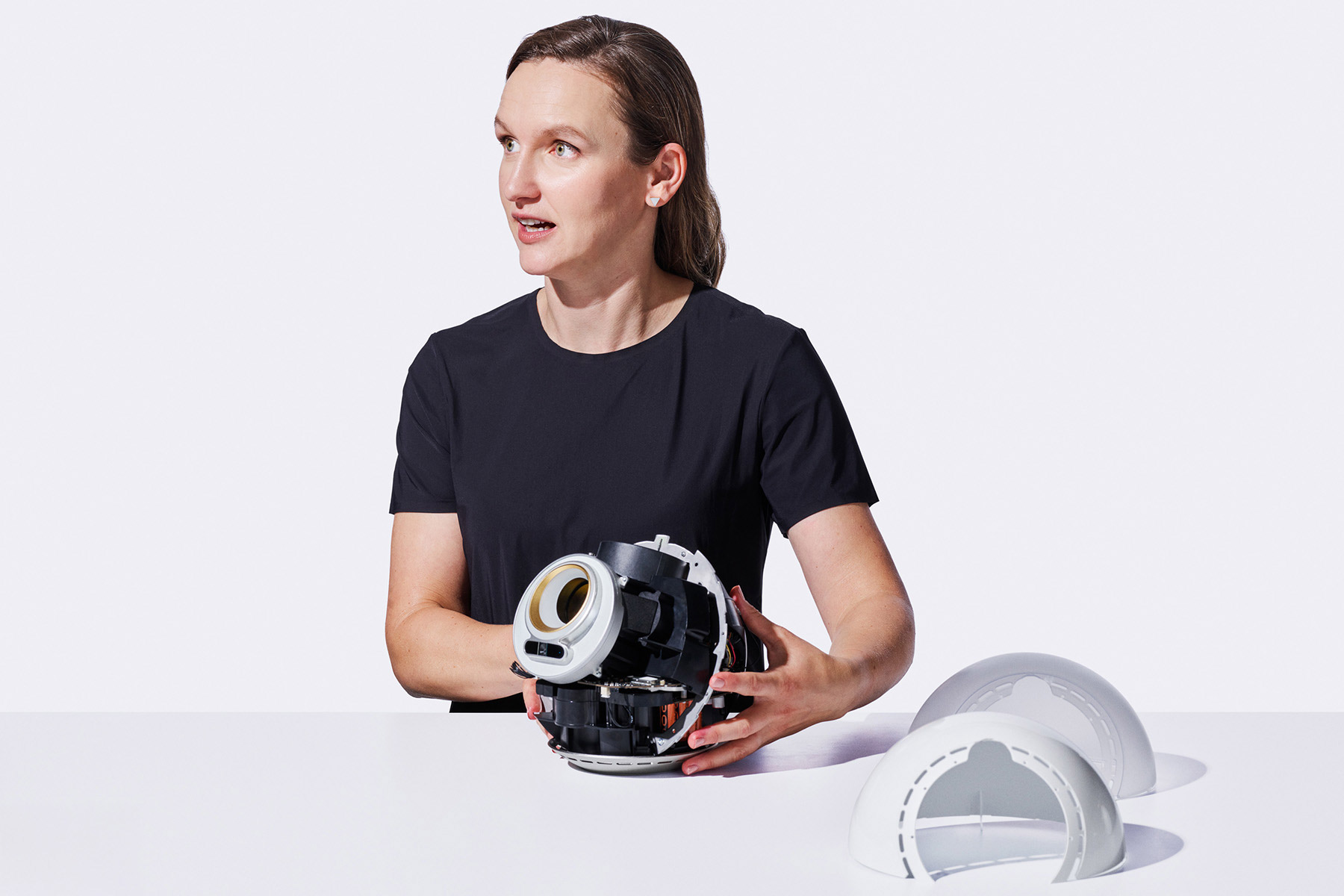 A person demonstrating the Orb while speaking about data security practices at World.