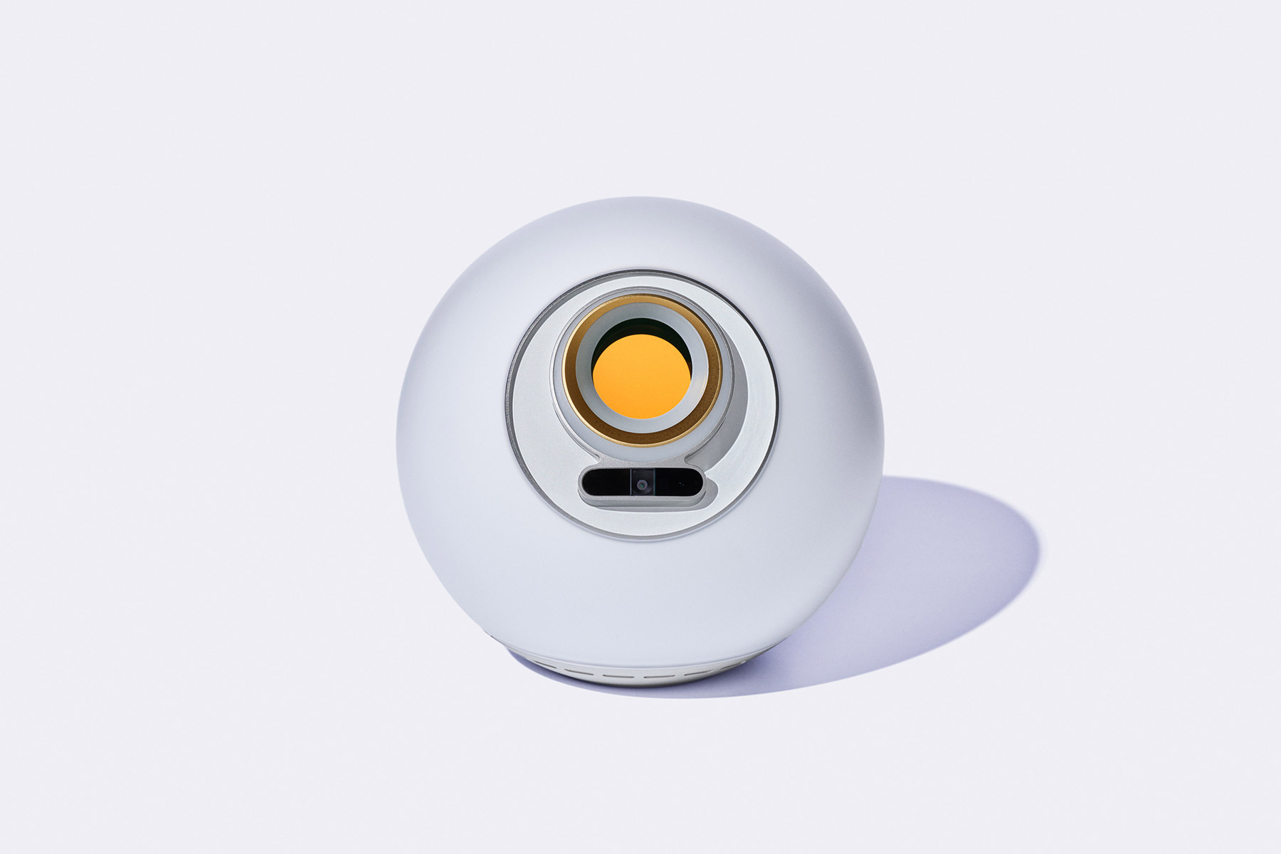 The Orb, a silver biometric verification device with a circular front lens, used for World ID verifications.