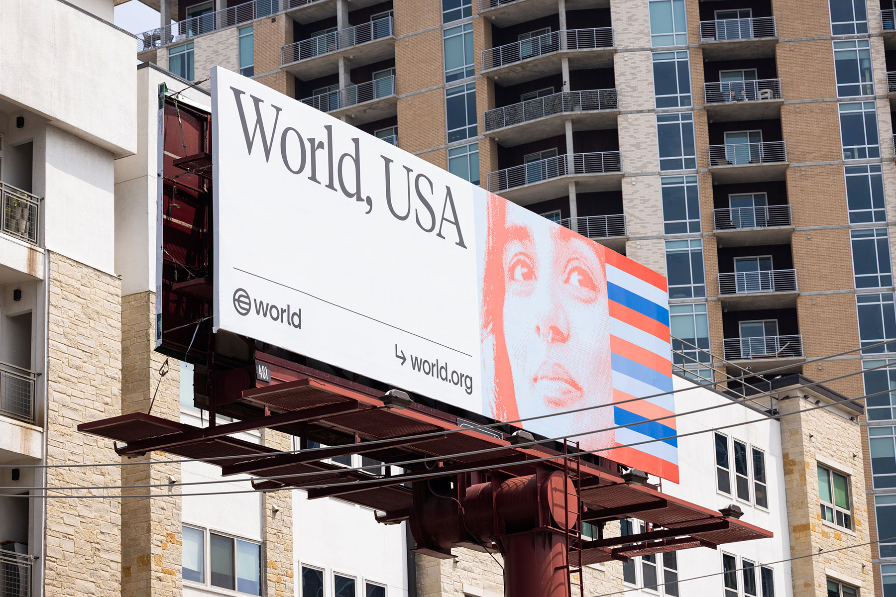 Billboard advertising World in the USA with an artistic face illustration and logo