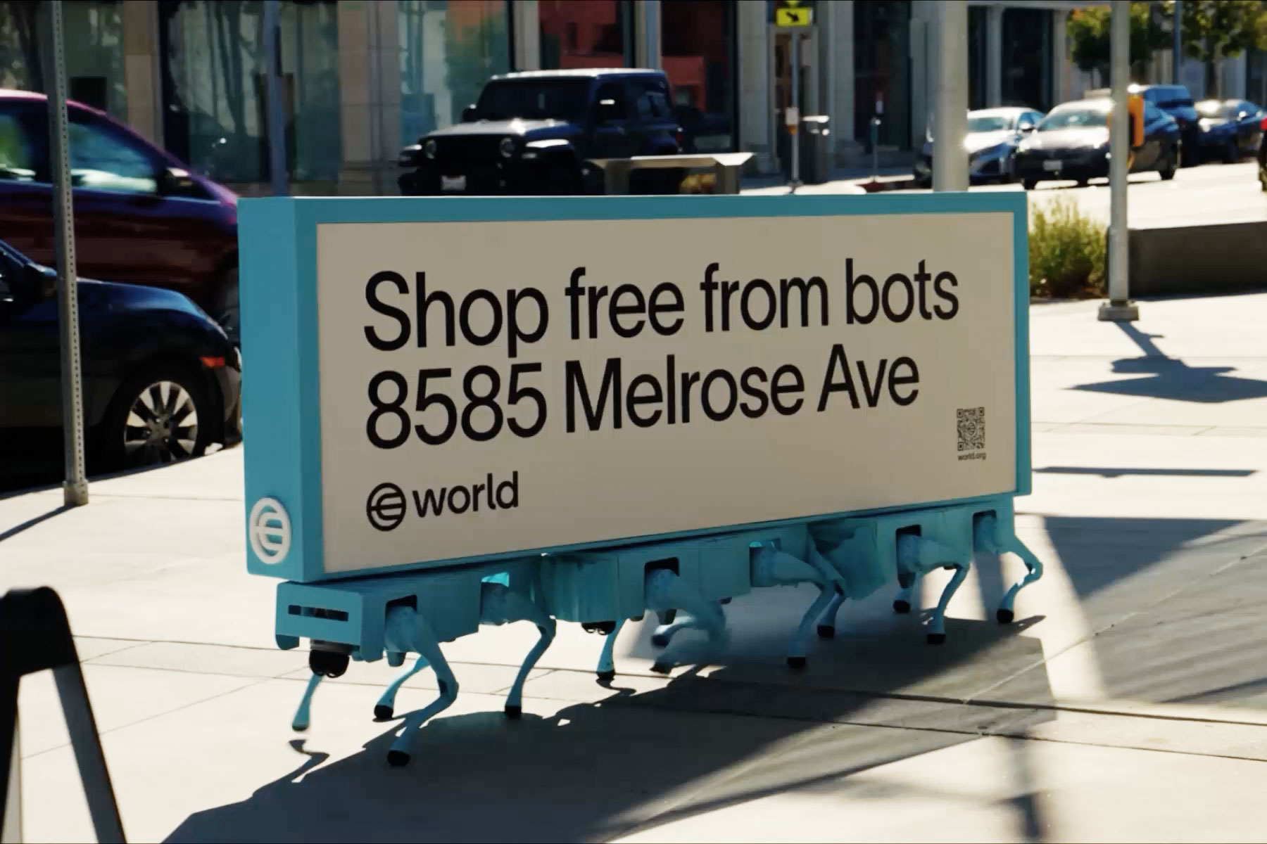 A large sign on a sidewalk reads 'Shop free from bots 8585 Melrose Ave' with the World logo, promoting human-centered shopping.