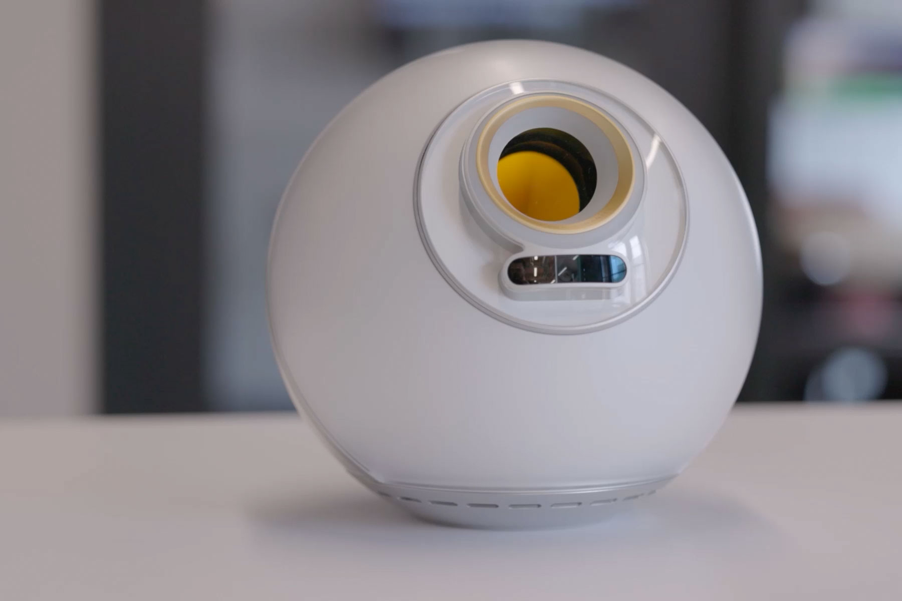 Close-up of the Orb, a biometric verification device, on a table.