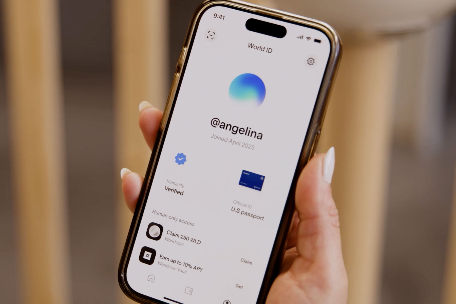 A user interface of the World App displaying a verified World ID profile with the username '@angelina', along with the timestamp and options for human-only access and claiming WLD rewards.
