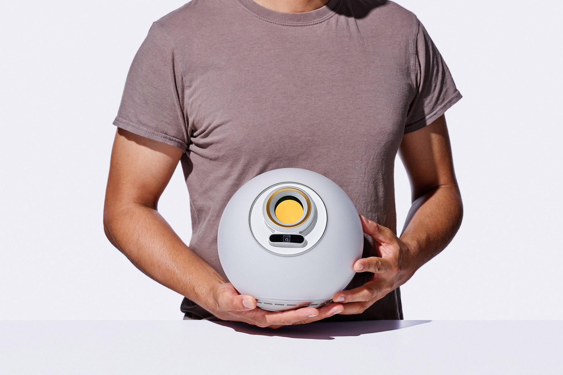 A person holding an Orb, showcasing its design and functionality.