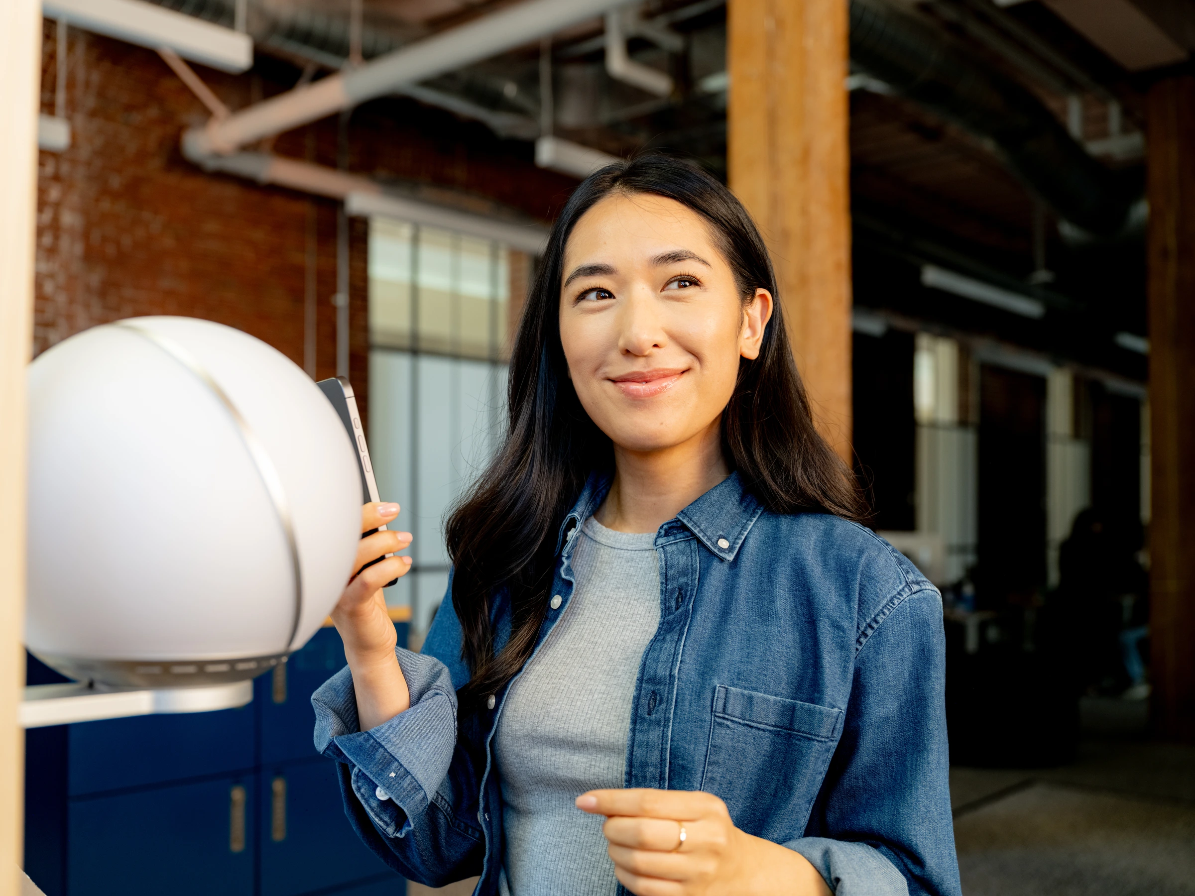 A woman verifying her World ID at an Orb